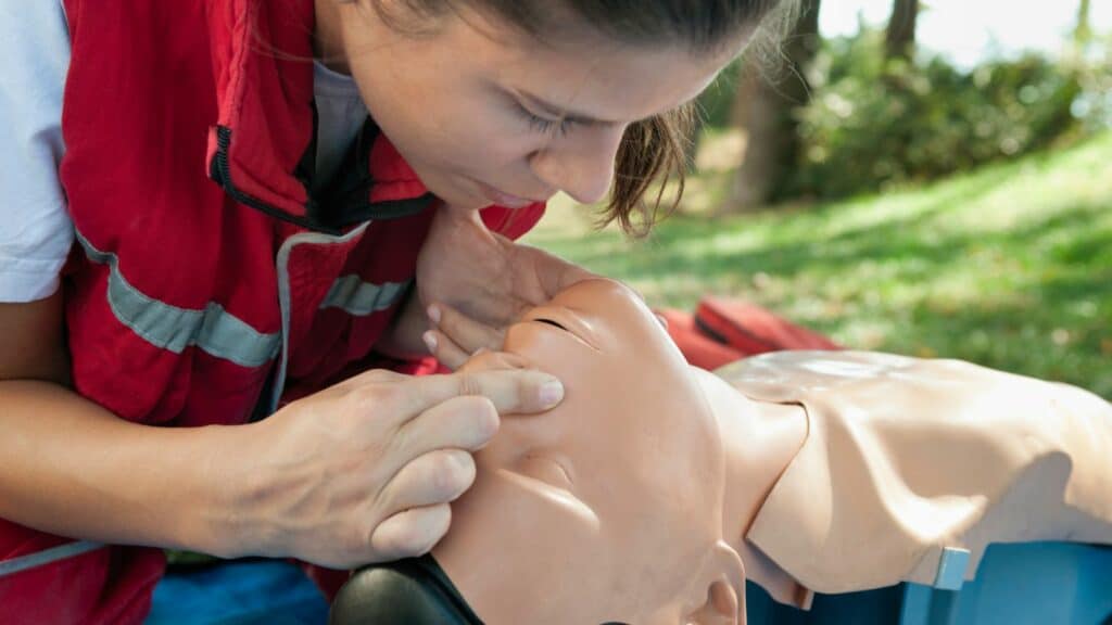 SureFire CPR Instructor giving giving mouth-to-mouth cpr