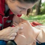SureFire CPR Instructor giving giving mouth-to-mouth cpr