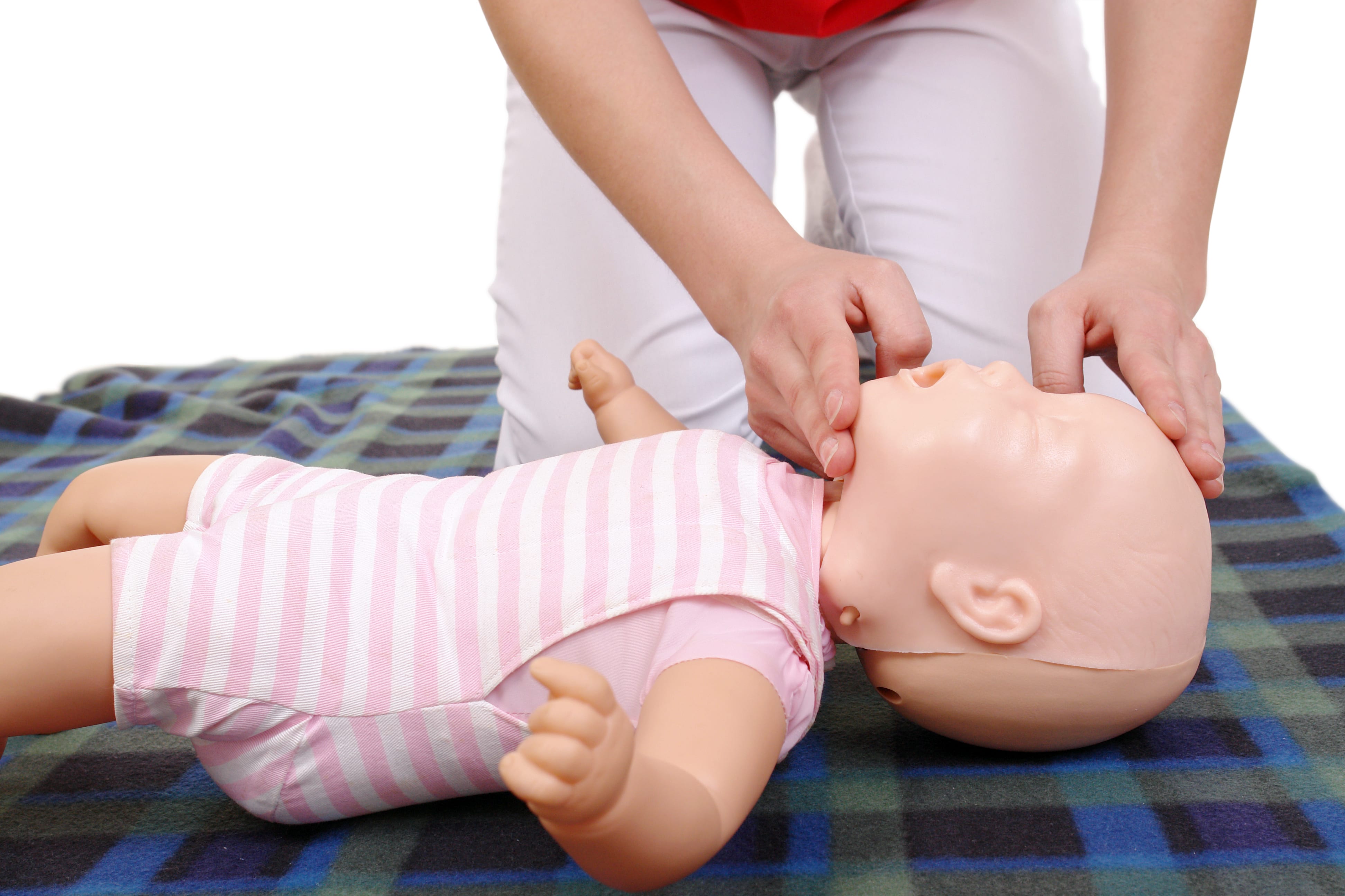 Infant dummy first aid demonstration series - First aid instructor showing how to position infant head before proceeding to mouth-to-mouth resuscitation